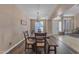 Cozy dining room with modern light fixture and seating for six at 3707 N 188Th Ave, Litchfield Park, AZ 85340