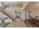 Grand foyer with a staircase, tile flooring, and an open layout leading to the living spaces at 3707 N 188Th Ave, Litchfield Park, AZ 85340