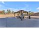 Beautiful gazebo with full seating in backyard overlooking spacious yard at 3707 N 188Th Ave, Litchfield Park, AZ 85340