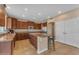 Spacious kitchen featuring granite countertops, ample cabinetry, and a functional island with seating at 3707 N 188Th Ave, Litchfield Park, AZ 85340