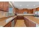 Spacious kitchen features stainless steel appliances, granite counters and oversized windows at 3707 N 188Th Ave, Litchfield Park, AZ 85340