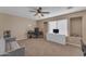 Spacious living room featuring a desk, TV and plenty of natural light from a large window at 3707 N 188Th Ave, Litchfield Park, AZ 85340