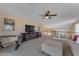 Upstairs loft featuring carpet floors, ceiling fan, game table and tv at 3707 N 188Th Ave, Litchfield Park, AZ 85340