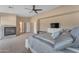 Spacious main bedroom featuring a fireplace, neutral paint, carpet and ensuite bath at 3707 N 188Th Ave, Litchfield Park, AZ 85340