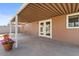 View of back patio that features a covered area, and double doors to the backyard at 3724 E Joan De Arc Ave, Phoenix, AZ 85032