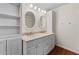 Bathroom with double sinks, cabinets and shelving, and an oval mirror at 3724 E Joan De Arc Ave, Phoenix, AZ 85032