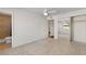 Bright bedroom features neutral carpet, a ceiling fan, and a mirrored closet, creating a serene and inviting space at 3724 E Joan De Arc Ave, Phoenix, AZ 85032