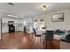 Bright kitchen with white cabinets, granite countertops, and stainless steel appliances, adjacent to a cozy breakfast nook at 3724 E Joan De Arc Ave, Phoenix, AZ 85032