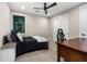 Modern bedroom with a queen bed, a large window and door, and an office desk at 4109 N 57Th St, Phoenix, AZ 85018