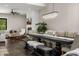 Elegant dining area with a modern chandelier and fireplace, perfect for entertaining at 4109 N 57Th St, Phoenix, AZ 85018