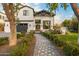 Beautiful modern farmhouse exterior with manicured landscaping and a stone walkway at 4109 N 57Th St, Phoenix, AZ 85018