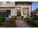 Charming two-story modern farmhouse with black trim, white siding and manicured landscaping at 4109 N 57Th St, Phoenix, AZ 85018