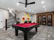 Spacious game room with exposed brick and staircase to the second floor at 4109 N 57Th St, Phoenix, AZ 85018