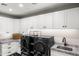 Well-organized laundry room with modern washer and dryer, ample cabinetry, and marble countertops at 4109 N 57Th St, Phoenix, AZ 85018