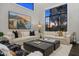 Bright and airy living room featuring modern sofas, stylish decor, and a large scenic window at 4109 N 57Th St, Phoenix, AZ 85018