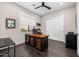 Bright office space featuring a custom wood desk, modern lighting, and dark hardwood floors at 4109 N 57Th St, Phoenix, AZ 85018