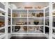 Open pantry shelving displays food stuffs and cookware at 4109 N 57Th St, Phoenix, AZ 85018