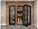 Wine cellar with dark wood racking system and display cases at 4109 N 57Th St, Phoenix, AZ 85018