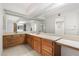 Bathroom featuring double sinks, a large mirror, and ample counter space at 4200 N Miller Rd # 220, Scottsdale, AZ 85251