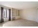 Bright bedroom with hardwood floors, a large window, and built in shelving at 4200 N Miller Rd # 220, Scottsdale, AZ 85251