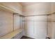 Walk-in closet with basic shelving, offering plenty of storage space for clothing and accessories at 4200 N Miller Rd # 220, Scottsdale, AZ 85251