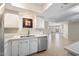 Kitchen area with stainless steel dishwasher, sink and a view to the living area at 4200 N Miller Rd # 220, Scottsdale, AZ 85251