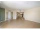 Open living room showcasing neutral tile floors and seamless flow into the kitchen area at 4200 N Miller Rd # 220, Scottsdale, AZ 85251