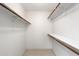 Spacious walk-in closet offering ample storage with shelves and rods at 4200 N Miller Rd # 220, Scottsdale, AZ 85251