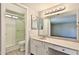 Bathroom featuring a vanity with a large mirror and a glass enclosed shower at 4536 W Bloomfield Rd, Glendale, AZ 85304