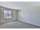 This bedroom features neutral walls, carpet, and a large window at 4536 W Bloomfield Rd, Glendale, AZ 85304