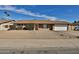 Charming single-story home features a brick facade, gravel landscaping and an attached two-car garage at 4536 W Bloomfield Rd, Glendale, AZ 85304