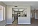 Bright kitchen with white cabinets, black appliances, and wood-look flooring at 4536 W Bloomfield Rd, Glendale, AZ 85304