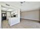 Open-concept living room and kitchen featuring modern flooring and a ceiling fan at 4536 W Bloomfield Rd, Glendale, AZ 85304