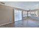 Bright and airy living space with wood laminate flooring, a ceiling fan and natural light at 4536 W Bloomfield Rd, Glendale, AZ 85304