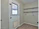 Mud room features a windowed door, shelves, and washer/dryer hookups at 4536 W Bloomfield Rd, Glendale, AZ 85304