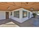 Corner view of the white painted brick home featuring the spacious covered patio at 4536 W Bloomfield Rd, Glendale, AZ 85304