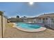 Relax in this backyard featuring a refreshing swimming pool, covered patio, and desert landscaping at 4536 W Bloomfield Rd, Glendale, AZ 85304