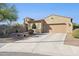 Charming single-story home with a tile roof and a well-manicured, desert landscaped front yard at 4960 S Huachuca Pl, Chandler, AZ 85249