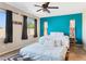 Relaxing main bedroom featuring a ceiling fan, neutral walls, ensuite, and natural light at 4960 S Huachuca Pl, Chandler, AZ 85249