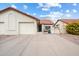 Charming single-story home with a two-car garage and a well-maintained, desert-landscaped front yard at 542 S Higley Rd # 83, Mesa, AZ 85206