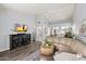 Bright living room featuring vaulted ceilings, hardwood floors, and a stylish leather sectional sofa at 542 S Higley Rd # 83, Mesa, AZ 85206