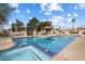 Community pool and hot tub with seating areas, surrounded by mature landscaping at 542 S Higley Rd # 83, Mesa, AZ 85206