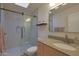 Modern bathroom with a walk-in shower, granite vanity top and contemporary finishes at 5518 E Cambridge Ave, Phoenix, AZ 85008