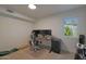 Bedroom featuring a large window for natural light, modern desk and a comfortable chair at 5518 E Cambridge Ave, Phoenix, AZ 85008