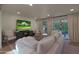 Comfortable living room with an abundance of natural light and a sliding door to a patio at 5518 E Cambridge Ave, Phoenix, AZ 85008