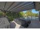 Inviting covered patio area, perfect for outdoor living with lush greenery and a sparkling pool at 5518 E Cambridge Ave, Phoenix, AZ 85008