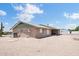 Back exterior of single story home with desert landscaping at 6308 E Billings St, Mesa, AZ 85205