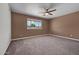 Bedroom featuring new carpet, neutral wall color, and a ceiling fan at 6308 E Billings St, Mesa, AZ 85205