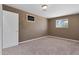 Cozy bedroom featuring carpeted floors and window with outdoor views at 6308 E Billings St, Mesa, AZ 85205