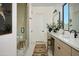 Modern bathroom featuring a glass-enclosed shower, sleek vanity, and stylish decor with new lighting at 6710 N 9Th Dr, Phoenix, AZ 85013